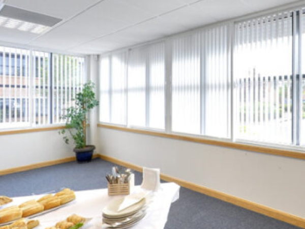 Securablinds vertical blinds in a bright office and meeting space with large windows