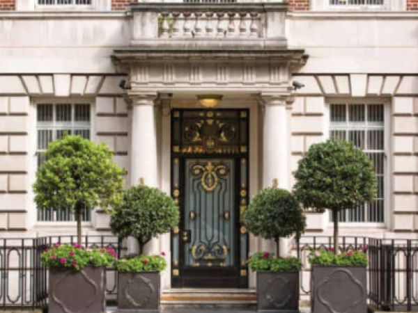 Securablinds at a formal building entrance with stone facade, columns, and windows fitted with vertical blinds