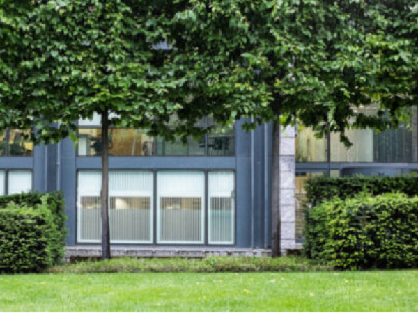 Securablinds on a modern commercial building with large glazed openings and landscaped grounds